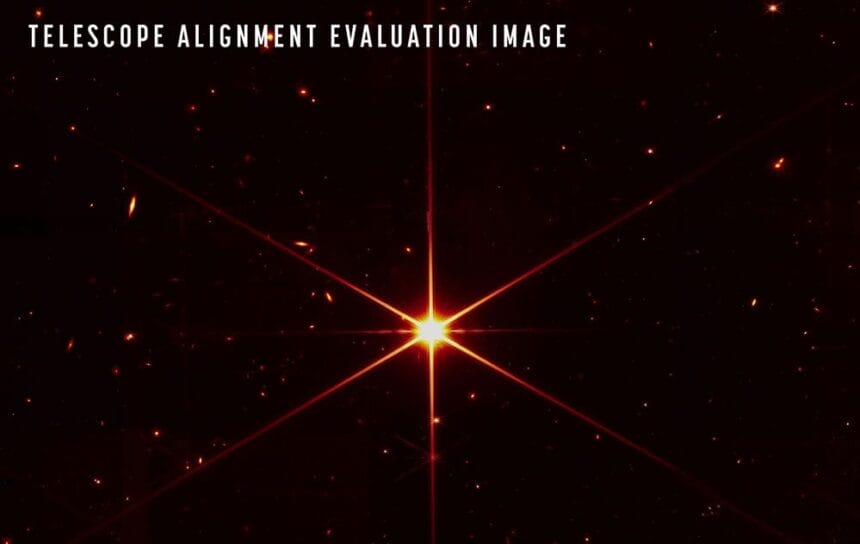 While the purpose of this image was to focus on the bright star at the center for alignment evaluation, Webb's optics and NIRCam are so sensitive that the galaxies and stars seen in the background show up. At this stage of Webb’s mirror alignment, known as “fine phasing,” each of the primary mirror segments have been adjusted to produce one unified image of the same star using only the NIRCam instrument. This image of the star, which is called 2MASS J17554042+6551277, uses a red filter to optimize visual contrast. Credits: NASA/STScI