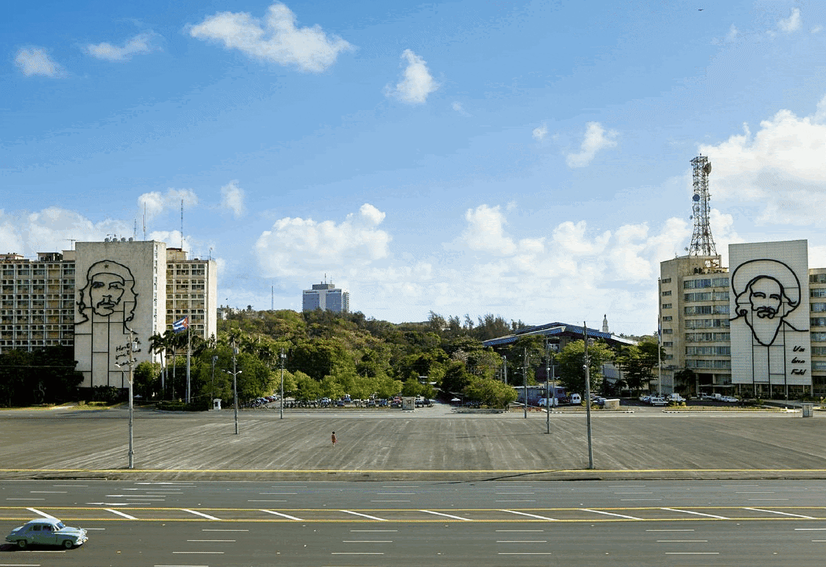 Coco Fusco, The Empty Plaza / La Plaza Vacia I, 2012. Digital chromogenic print. 26 1/8 x 39 1/2 in (66.36 x 100.33 cm); Arnie Zimmerman, Miramichi, 2003. Soda fired white stoneware. 16 x 20 x 12 in (40.64 x 50.8 x 30.48 cm); Luis Camnitzer, Canales, 1980. Typed document and map. Part 1: 11 x 8 1/2 in (27.9 x 21.6 cm); Part 2: 8 x 10 in (20.3 x 25.4 cm); 14 x 23 x 2 in framed (35.6 x 58.4 x 5.1 cm framed); Valeska Soares, Sea / Sea, 2007. Metallic ink on porcelain. Dimensions variable. Plates 12 5/8 in diameter each (32.07 cm diameter each)