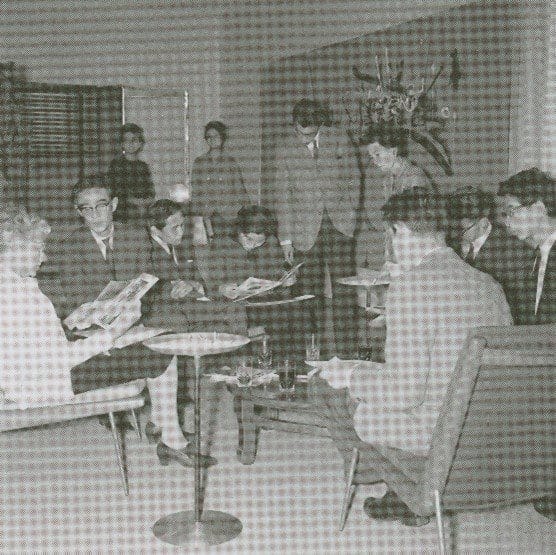 From left to right: Peggy Guggenheim, Jiro Yoshihara, Yoko Ono (reading), Michio Yoshihara, Atsuko Tanaka, David Tudor and John Cage facing this painting in 1962