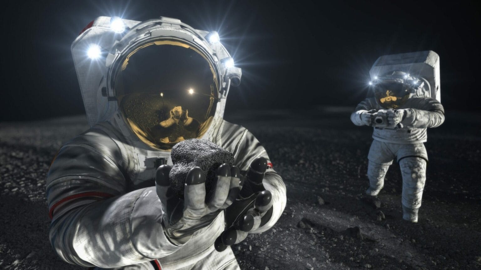 An artist’s illustration of two suited crew members working on the lunar surface. The one in the foreground lifts a rock to examine it while the other photographs the collection site in the background. Credits: NASA