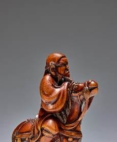 A wood Netsuke of a mounted Chinese horseman by Hoshin, Kyoto, late 18th century sold for €127,400